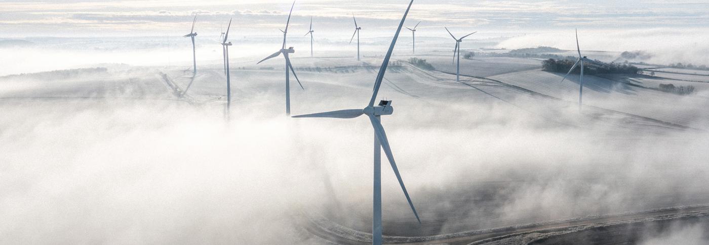Wind turbines on a frosty and foggy morning