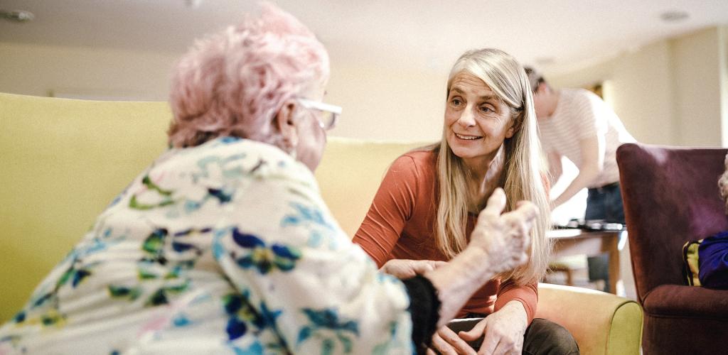 Conversation with two people one with pink hair
