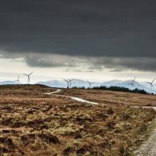 Wind turbines in stormy sky
