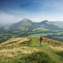 Person walking on a mountain path