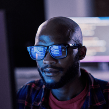 Worker looking at screen showing data
