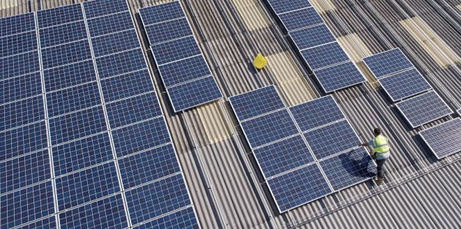 Solar panel installation on factory roof