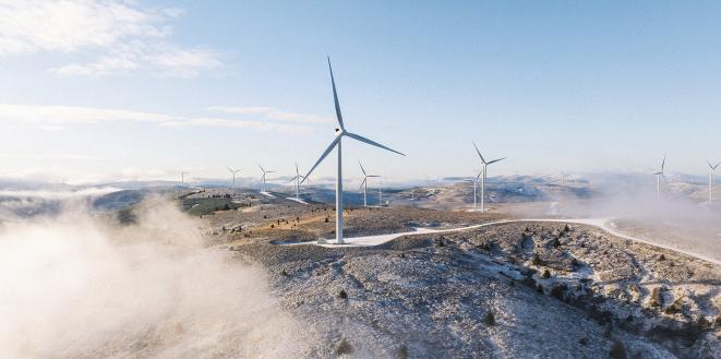 wind turbines across top of mountains