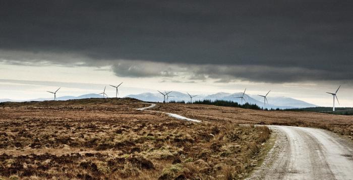 Wind turbines in stormy sky