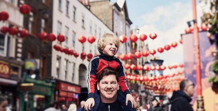 Dad with son on shoulders