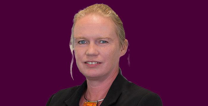 Hannah Nixon Headshot on purple background