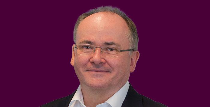 John Linwood Headshot on purple background