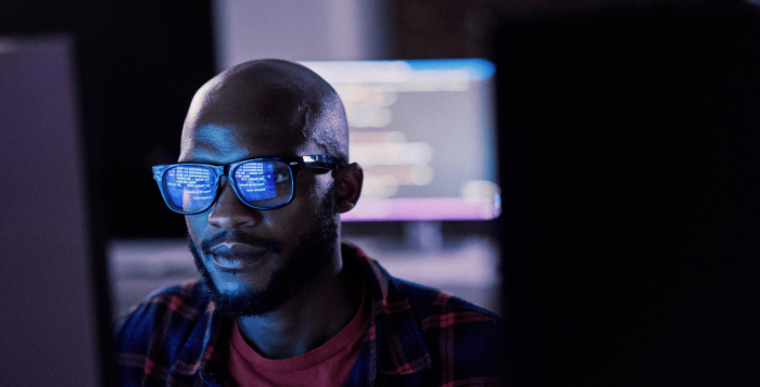 Worker looking at screen showing data