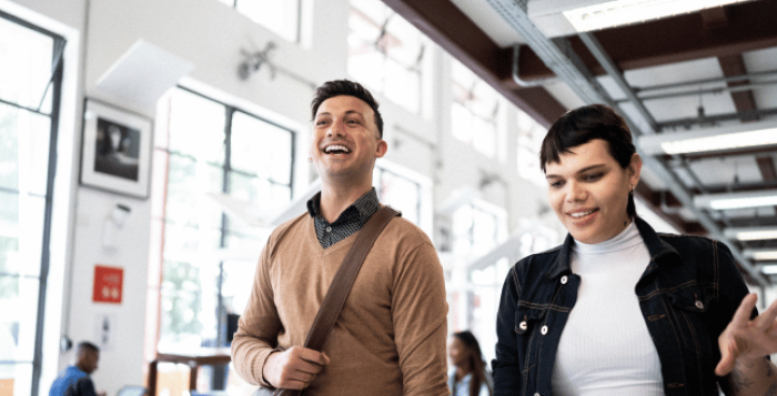 People walking through office